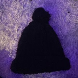 The brand is Talla Única, one size fits all, black